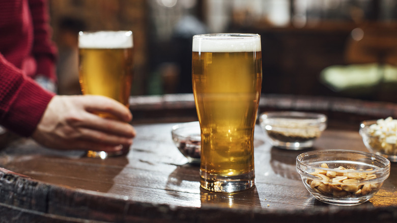 light beer pints with hand