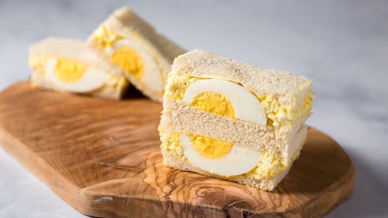 Japanese egg sandwiches on wooden board